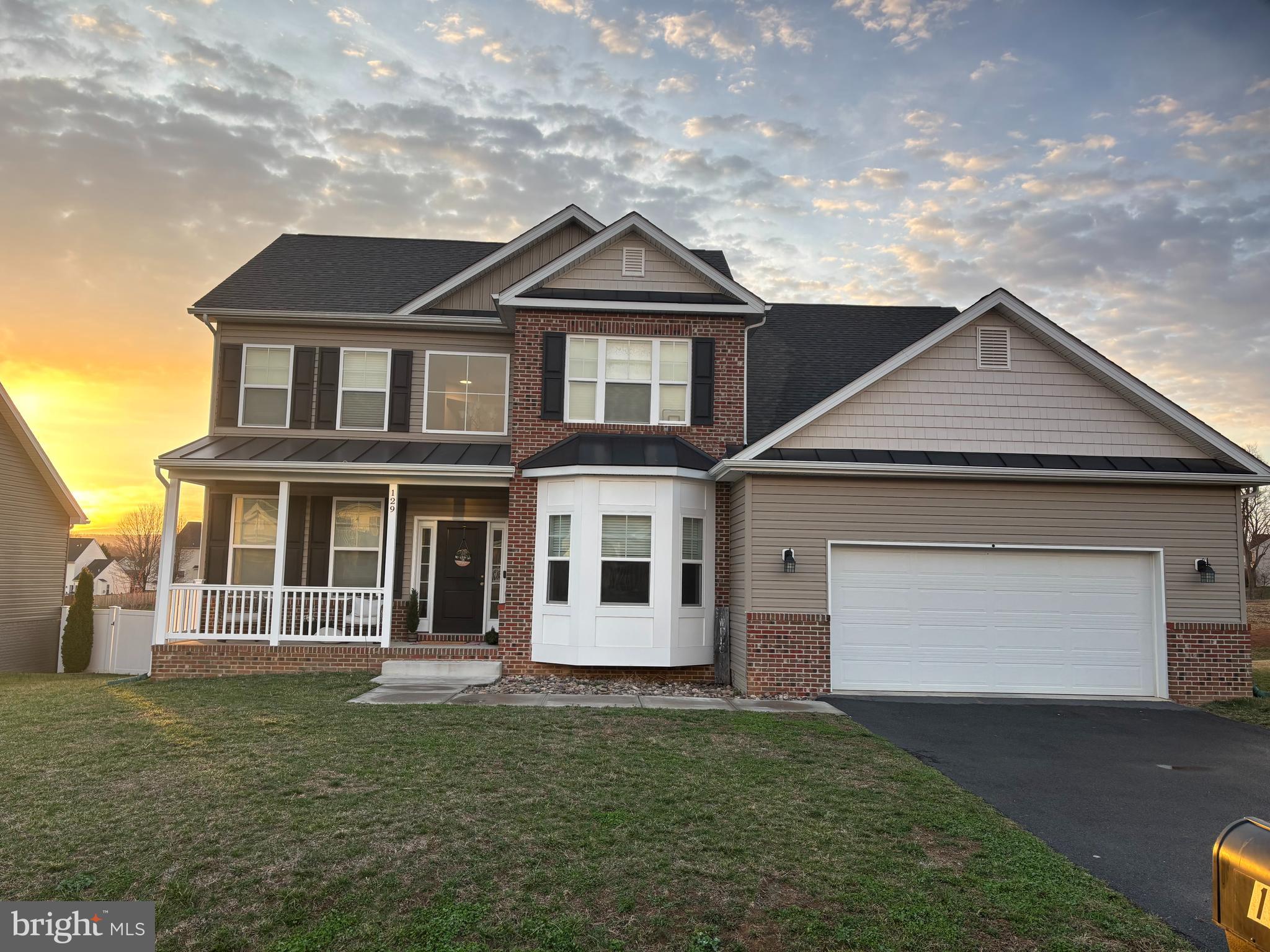 129 Constellation Road Inwood, WV 25428 - Photo 1 of 1 a front view of a house with a garden