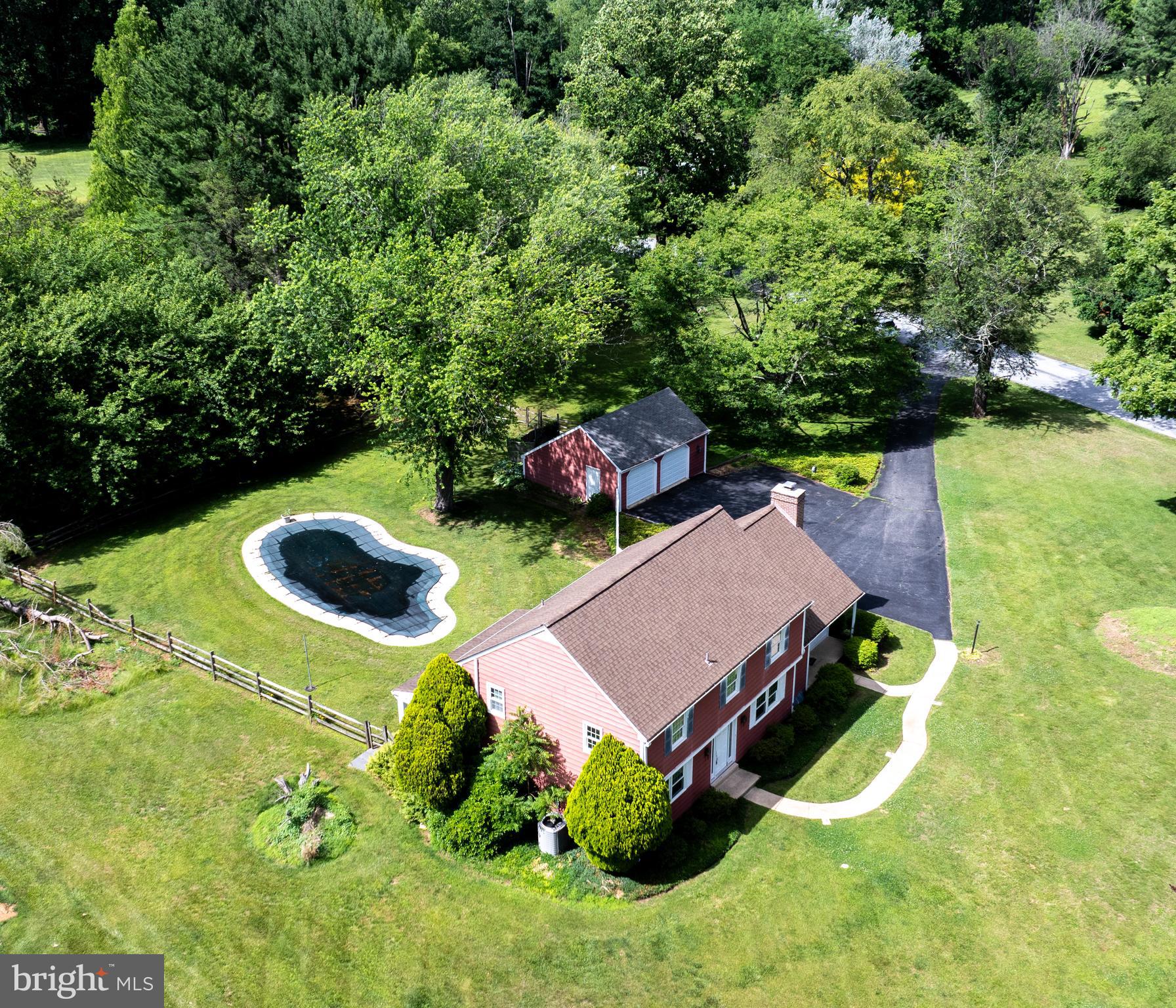 1929 Hillendale Road Chadds Ford, PA 19317 - Photo 14 of 56 an aerial view of a house with swimming pool and garden