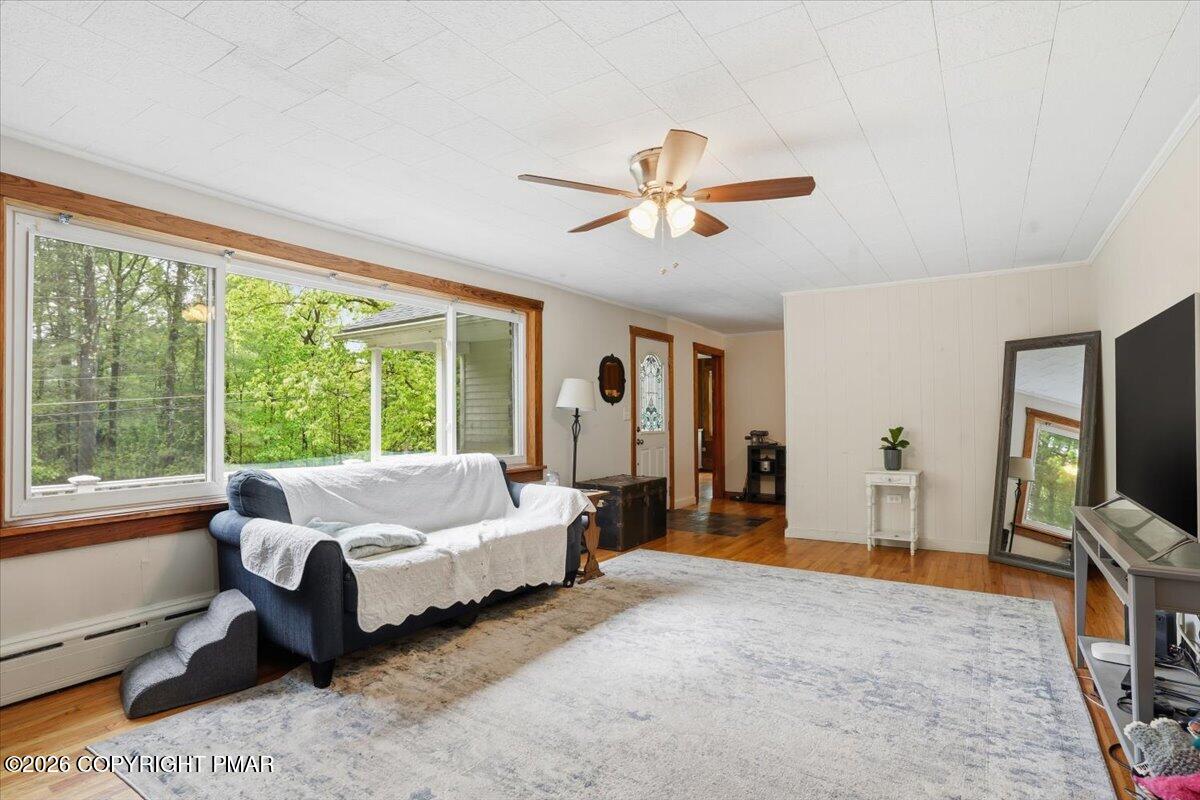 232 Garrity Road Hawley, PA 18428 - Photo 20 of 57 a spacious bedroom with a bed and a large window