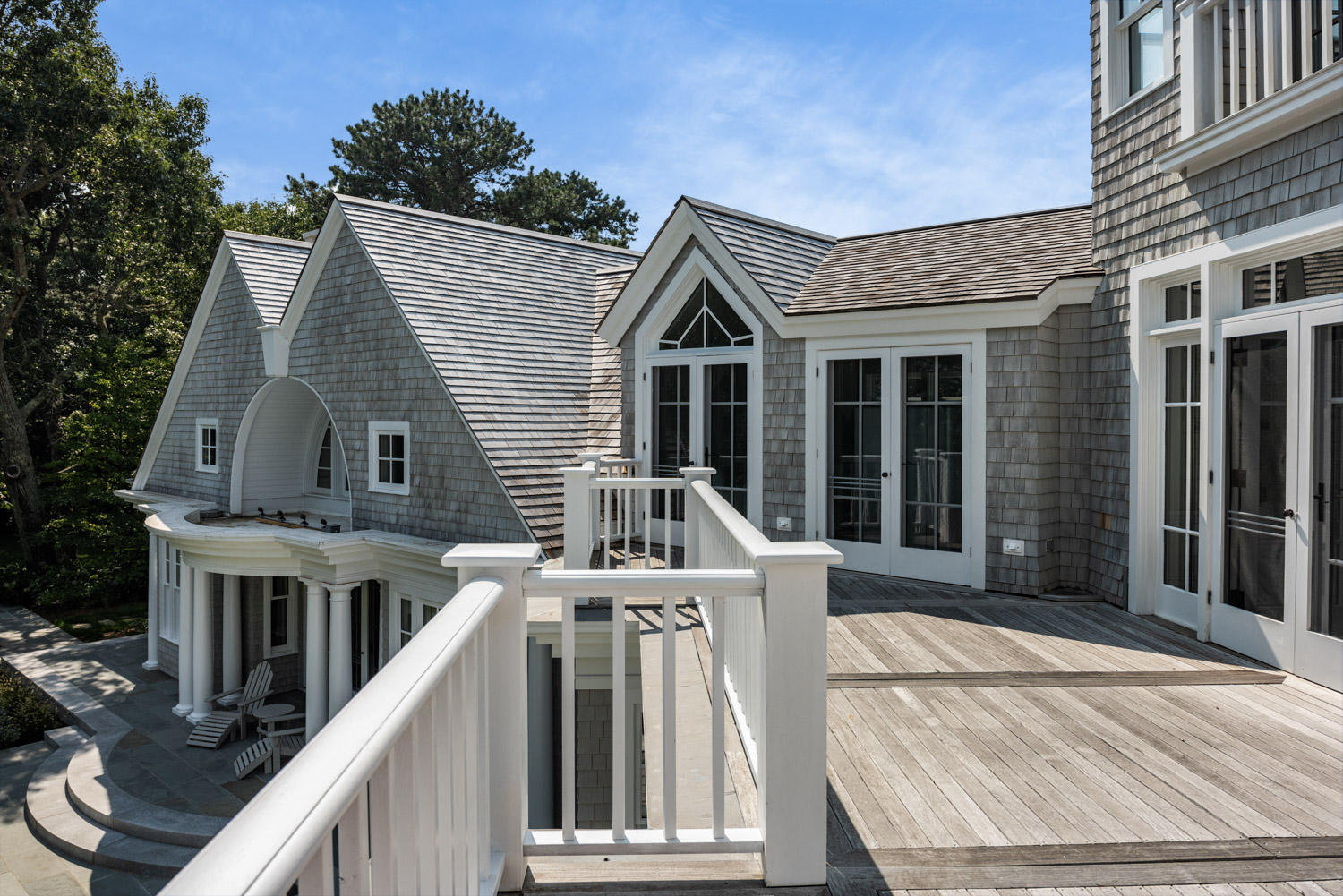 1025 Old Post Road Cotuit, MA 02635 - Photo 16 of 20 a front view of a house with a porch