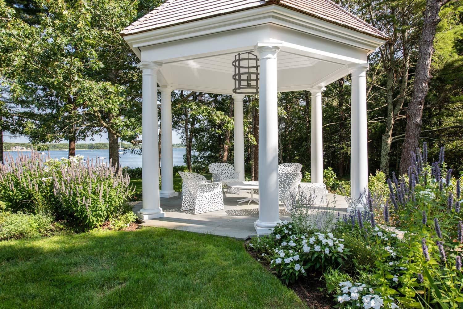 1025 Old Post Road Cotuit, MA 02635 - Photo 18 of 20 a view of a house with backyard and garden