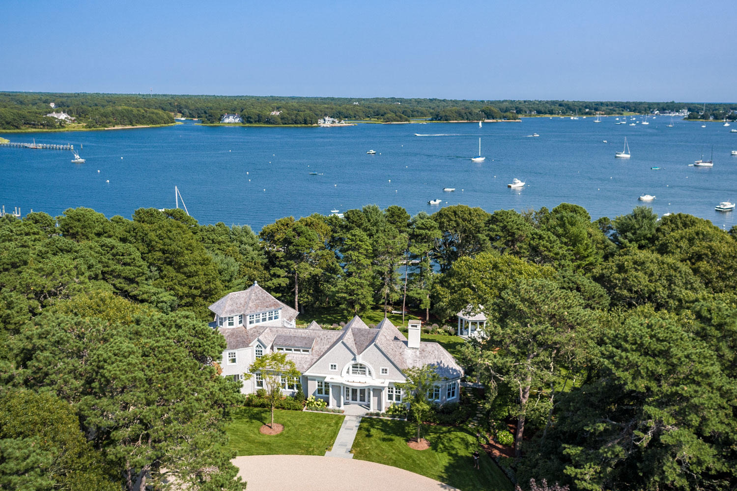 1025 Old Post Road Cotuit, MA 02635 - Photo 20 of 20 an aerial view of a house with a garden and lake view