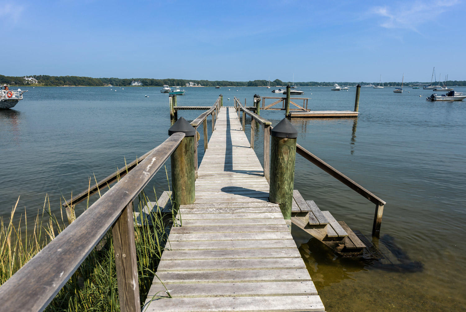 1025 Old Post Road Cotuit, MA 02635 - Photo 5 of 20 a view of a balcony with wooden floor and stairs