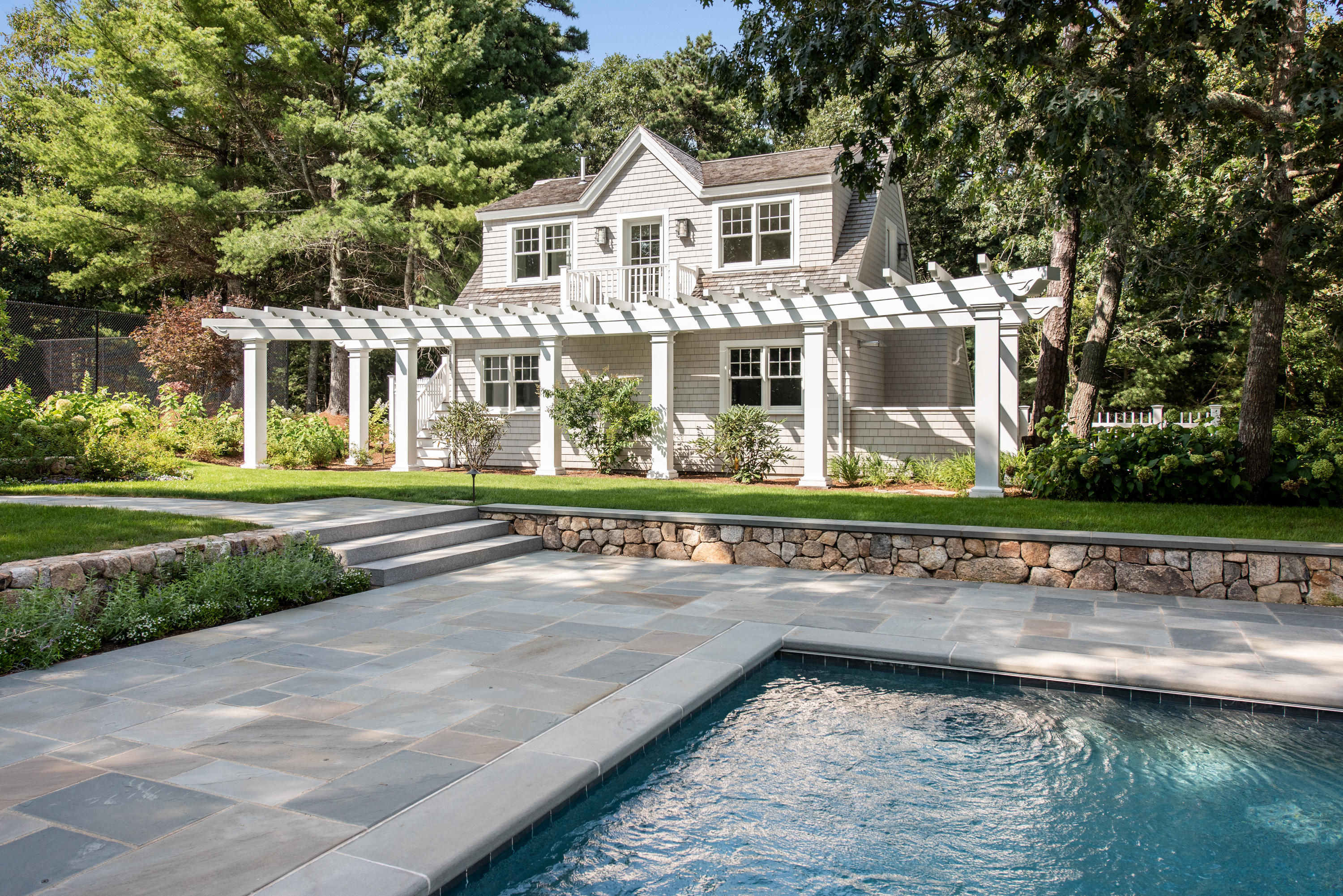 1025 Old Post Road Cotuit, MA 02635 - Photo 8 of 20 a front view of a house with a yard