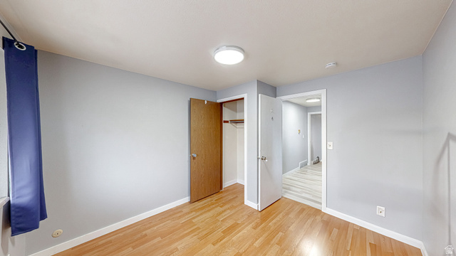630 1100 West Provo, UT 84601 - Photo 15 of 64 Room featuring wood-finish flooring and light gray walls