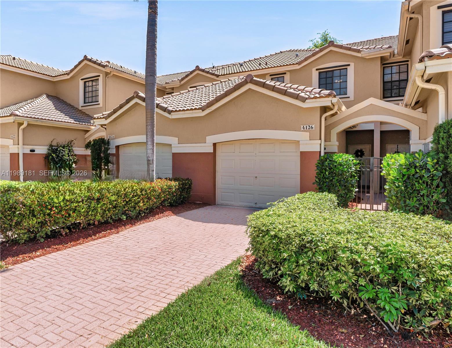 4126 Forest Drive Weston, FL 33332 - Photo 1 of 37 front view of a house with a yard