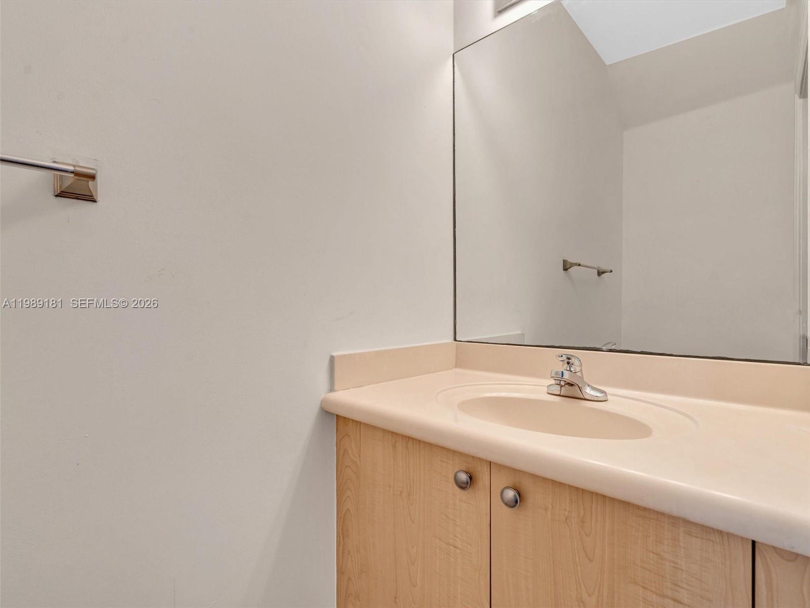 4126 Forest Drive Weston, FL 33332 - Photo 13 of 37 a bathroom with a sink and a mirror