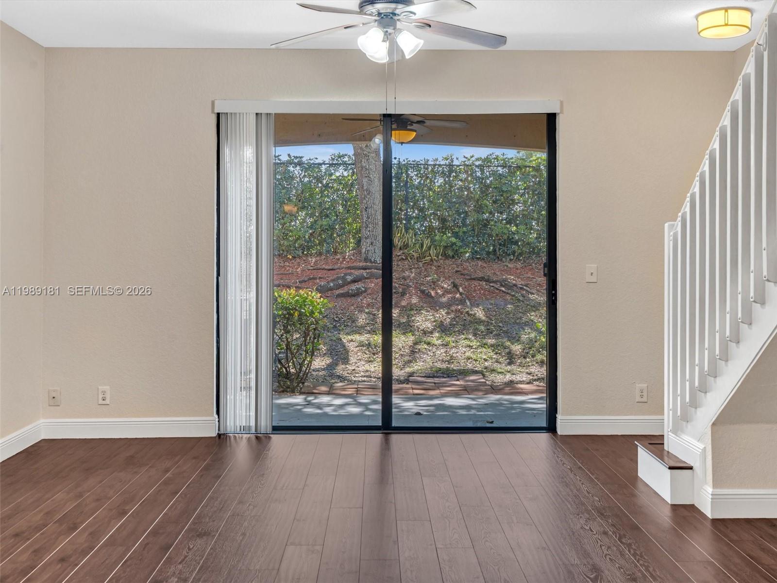 4126 Forest Drive Weston, FL 33332 - Photo 17 of 37 a view of an empty room with wooden floor and a window