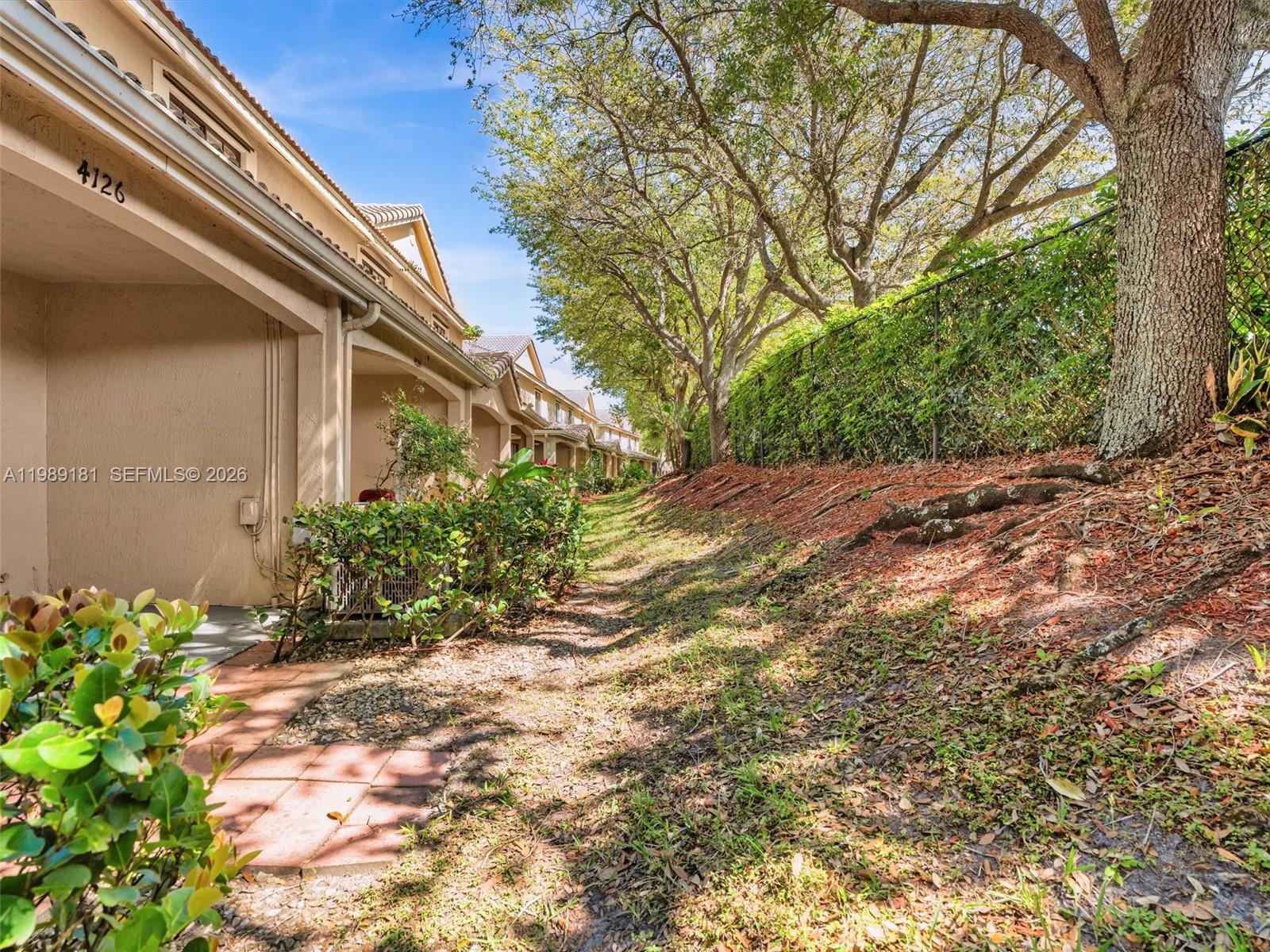 4126 Forest Drive Weston, FL 33332 - Photo 19 of 37 a view of a pathway of a building
