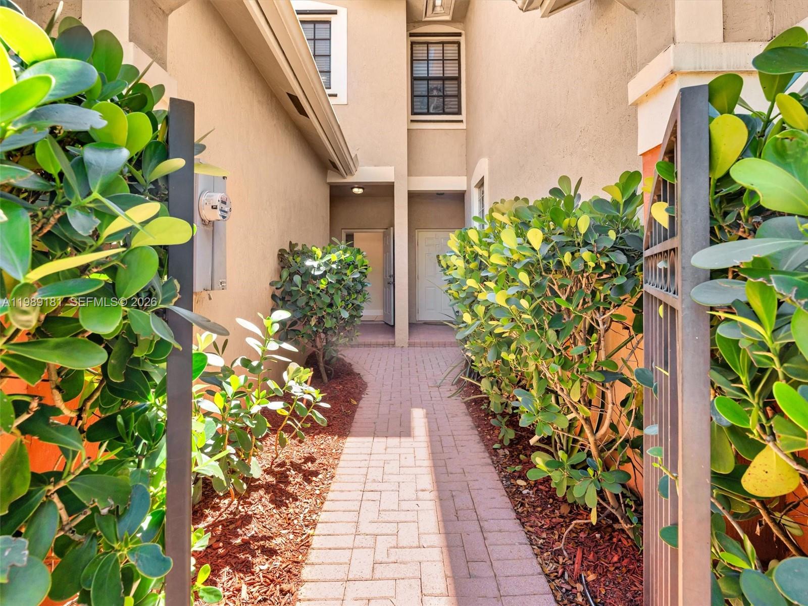 4126 Forest Drive Weston, FL 33332 - Photo 2 of 37 a view of path along with potted plants