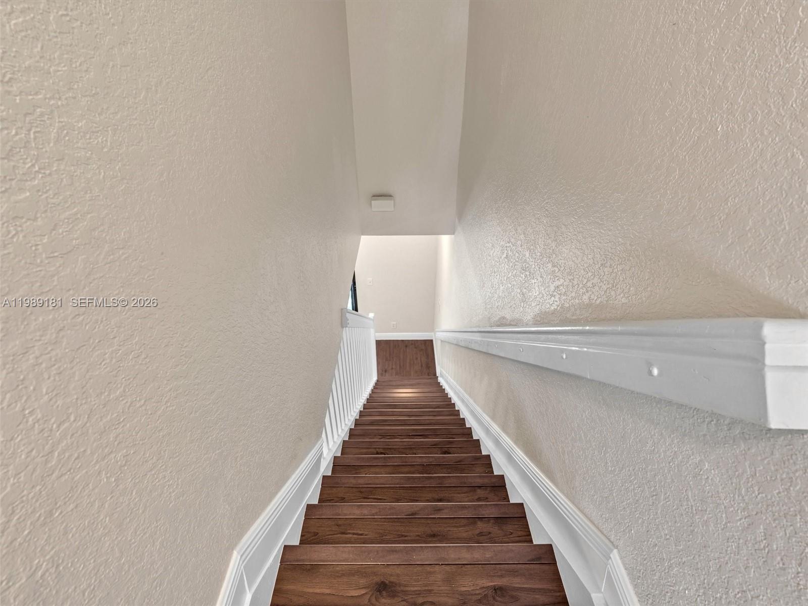 4126 Forest Drive Weston, FL 33332 - Photo 21 of 37 a view of entryway and hall with wooden floor