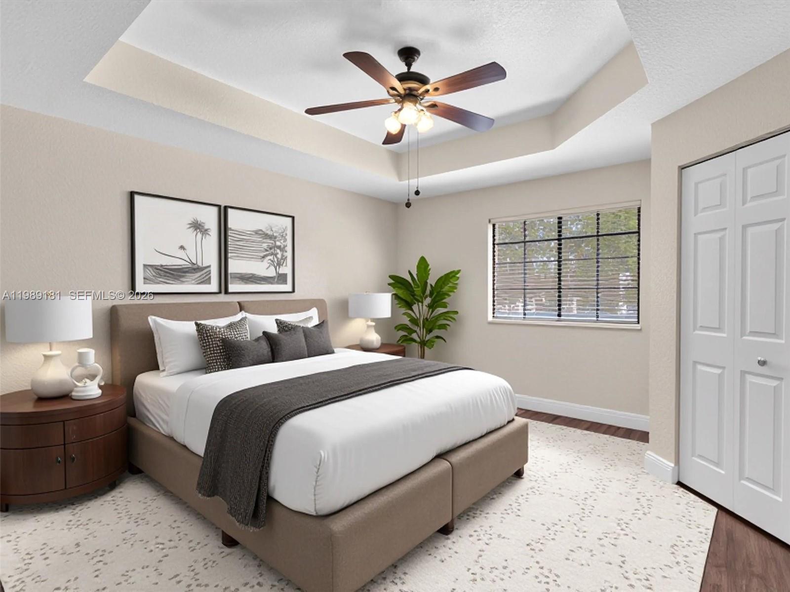 4126 Forest Drive Weston, FL 33332 - Photo 22 of 37 a bedroom with a large bed chandelier and a window