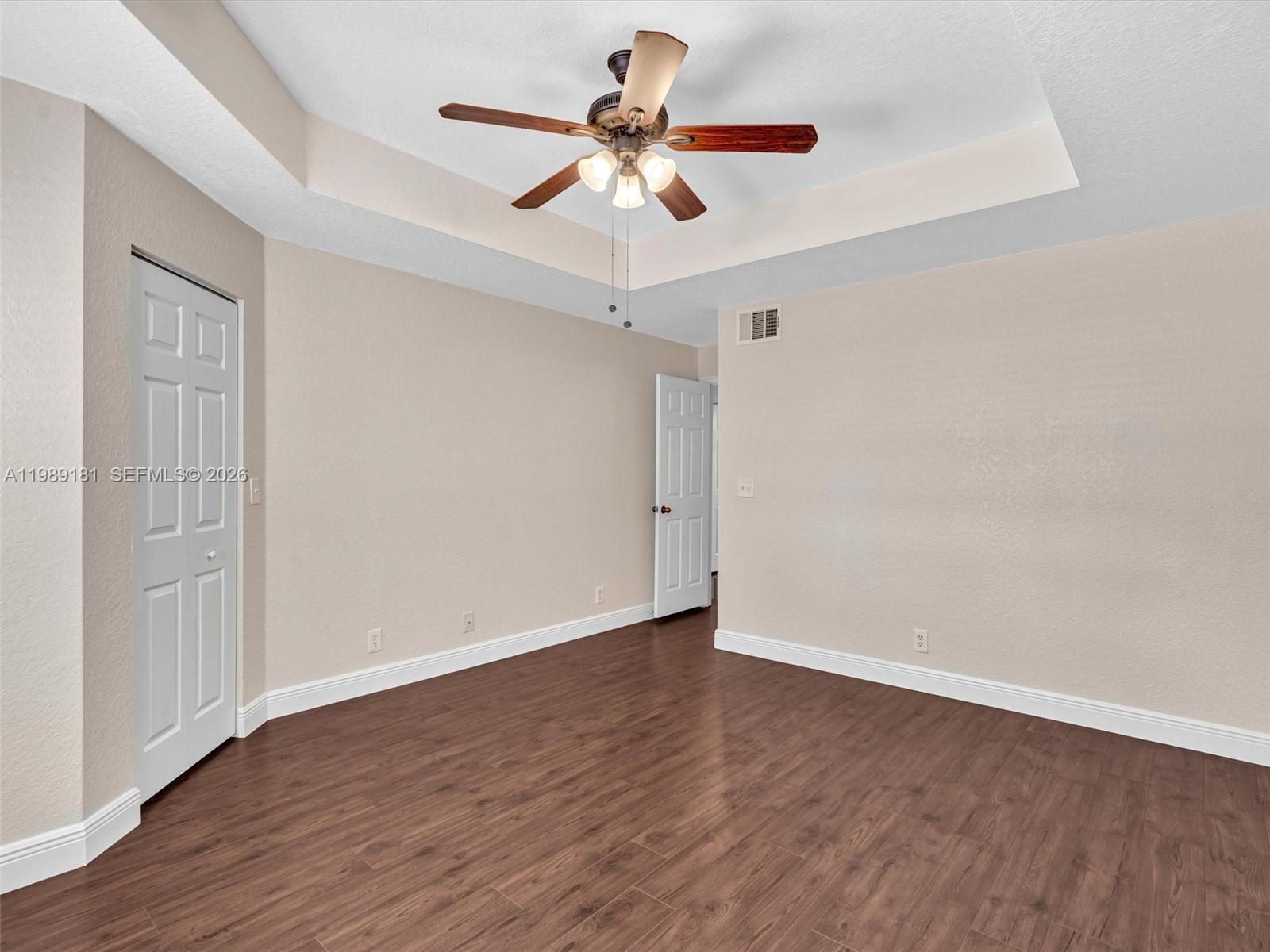 4126 Forest Drive Weston, FL 33332 - Photo 23 of 37 a view of room with hardwood floor and ceiling fan