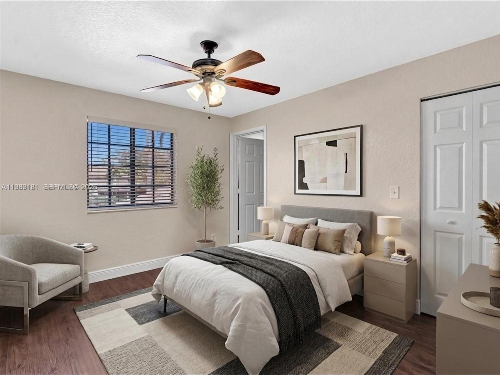4126 Forest Drive Weston, FL 33332 - Photo 26 of 37 a bedroom with a bed and wooden floor