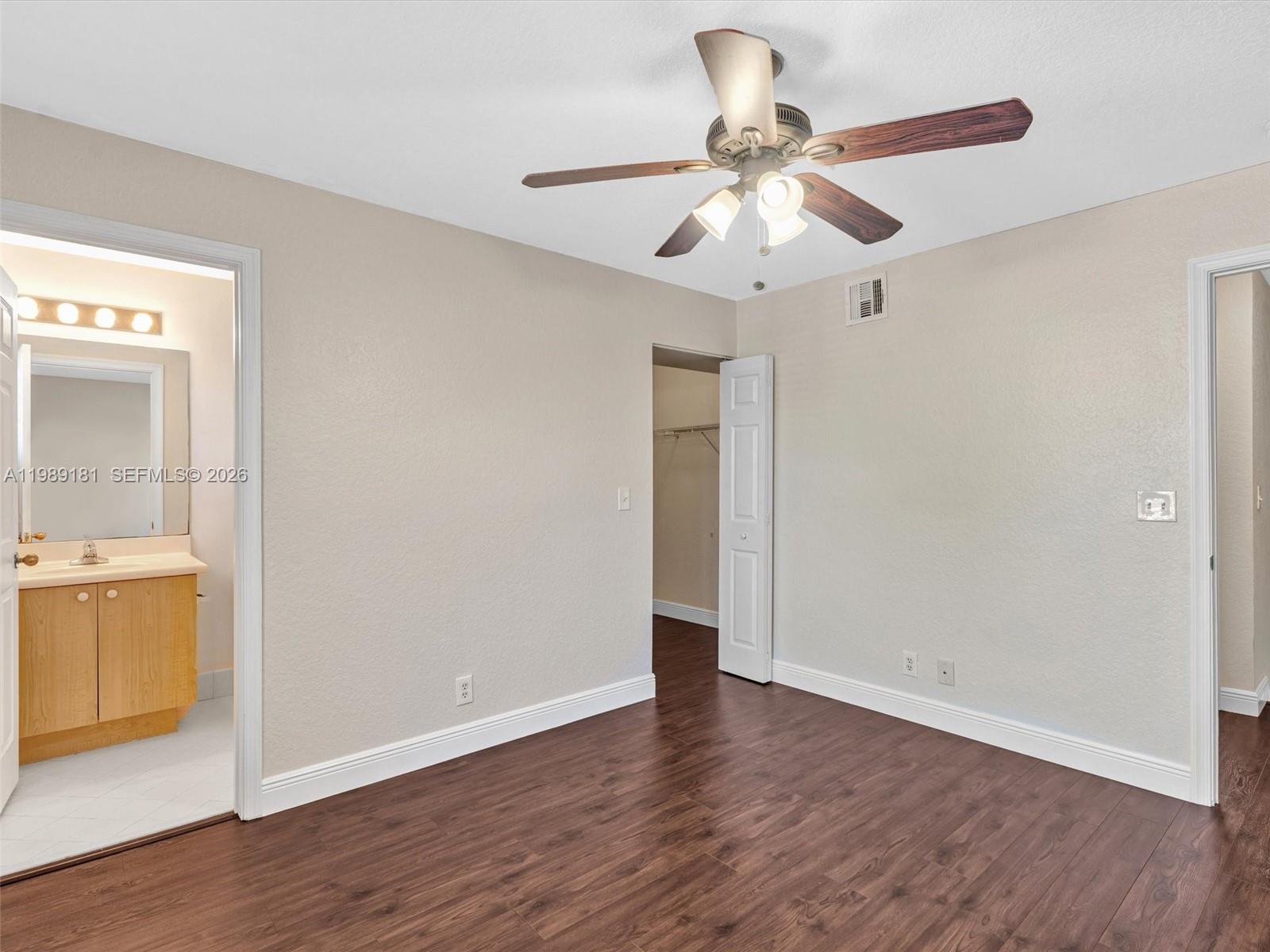 4126 Forest Drive Weston, FL 33332 - Photo 29 of 37 wooden floor in an empty room with a window