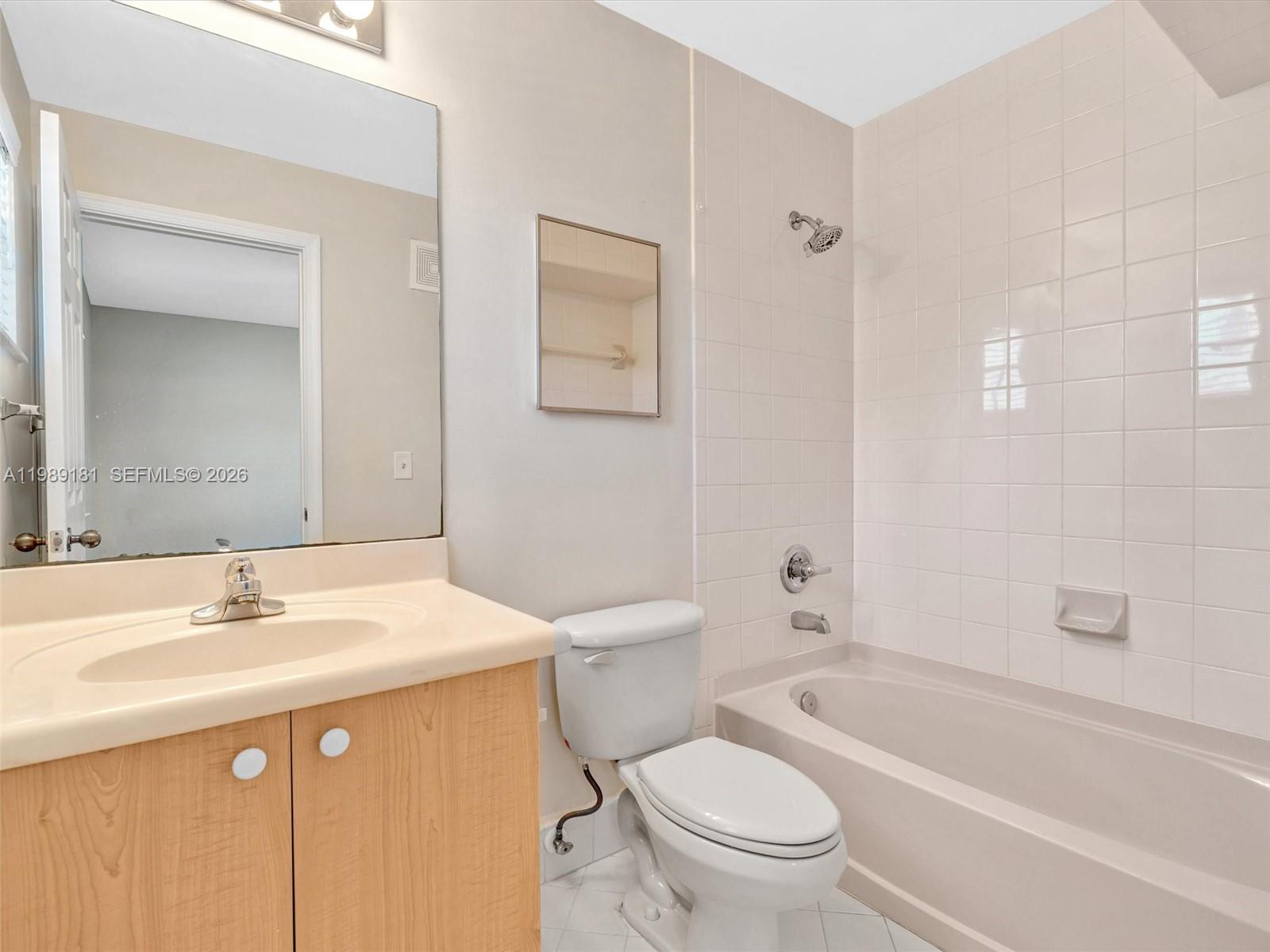 4126 Forest Drive Weston, FL 33332 - Photo 30 of 37 a bathroom with a sink a toilet and shower