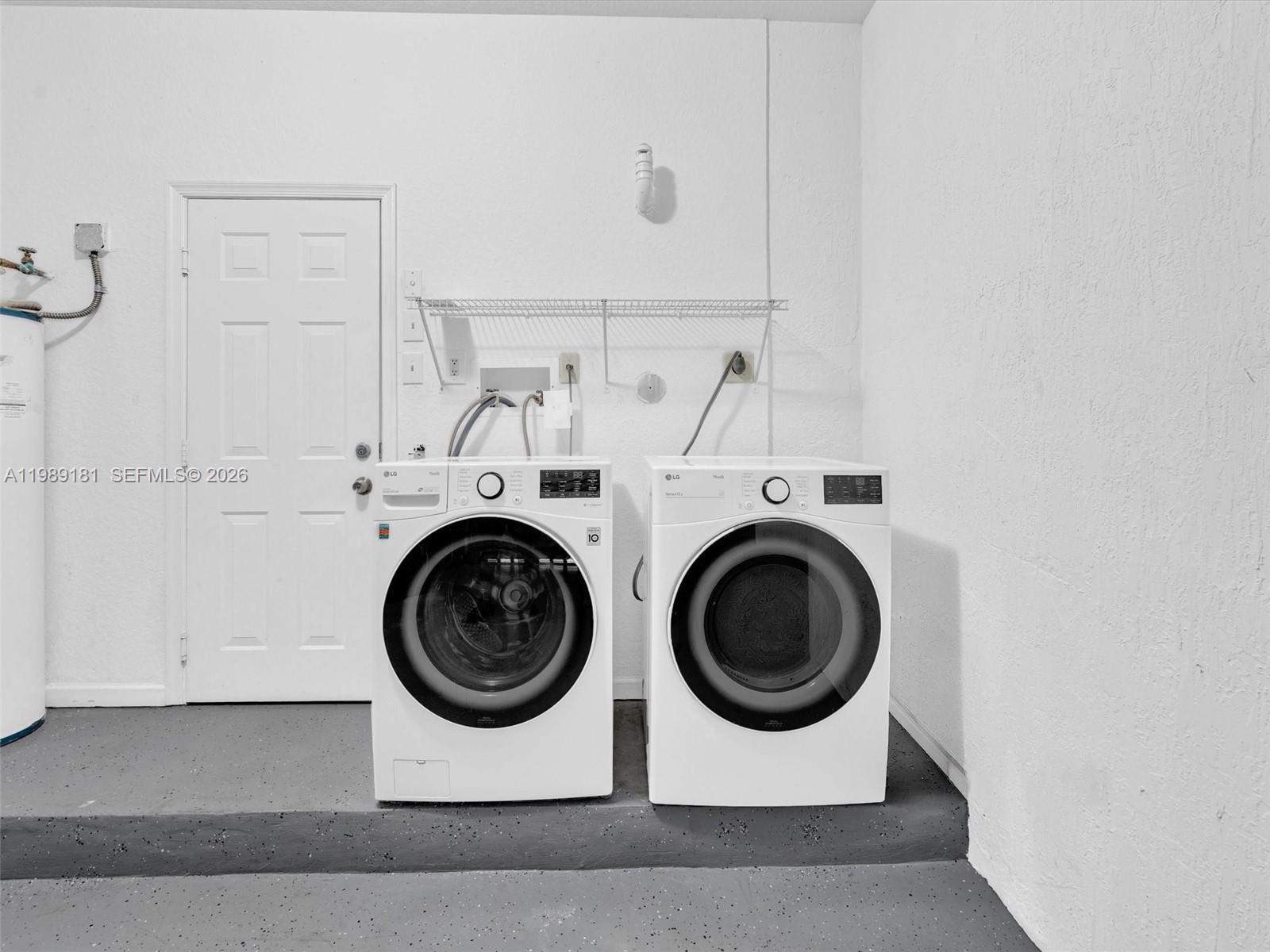 4126 Forest Drive Weston, FL 33332 - Photo 31 of 37 a utility room with dryer and washer