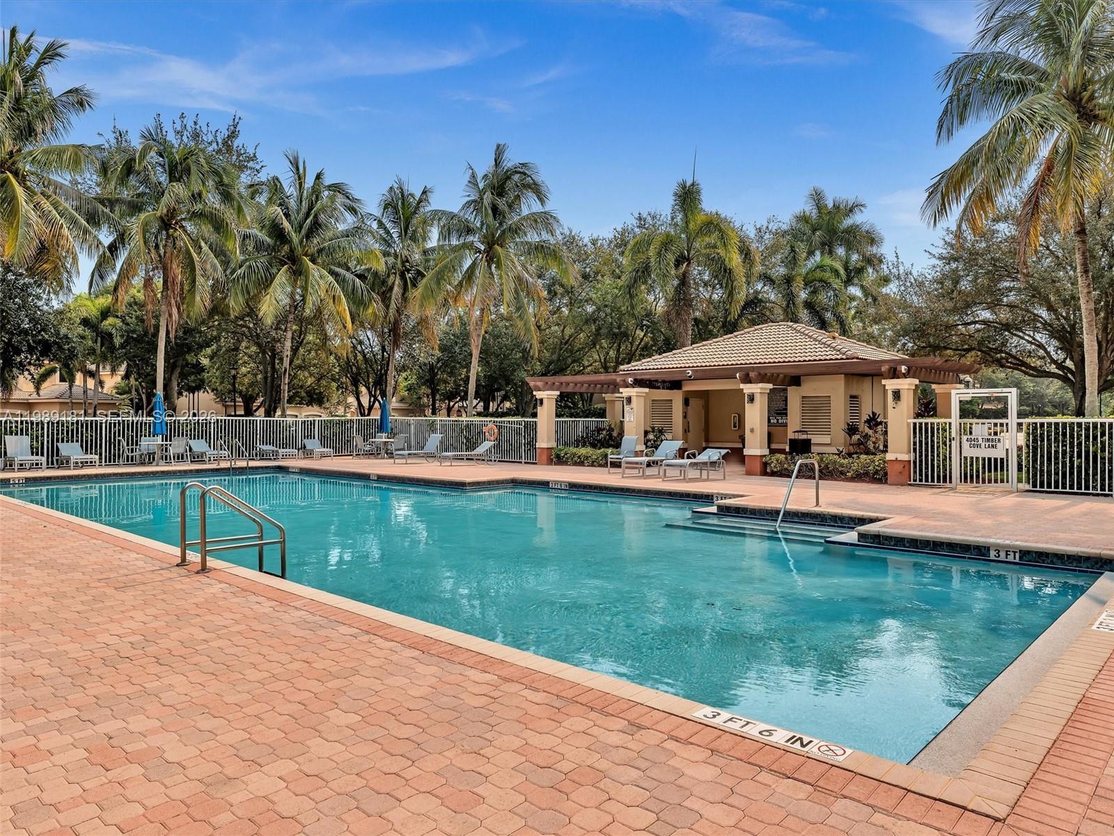 4126 Forest Drive Weston, FL 33332 - Photo 35 of 37 a house with swimming pool in front of it