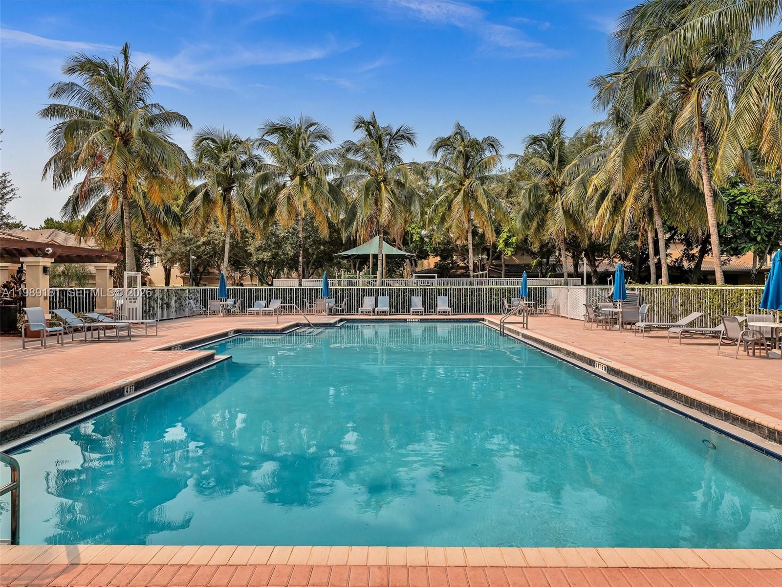4126 Forest Drive Weston, FL 33332 - Photo 36 of 37 a swimming pool with outdoor seating and yard