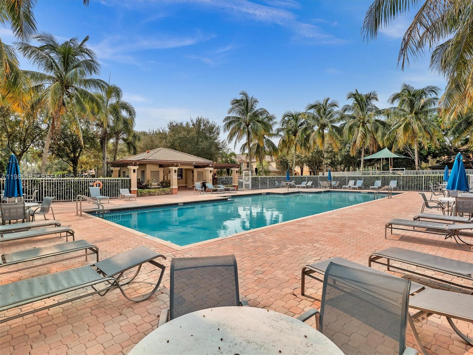 4126 Forest Drive Weston, FL 33332 - Photo 37 of 37 a view of yard with swimming pool and outdoor seating