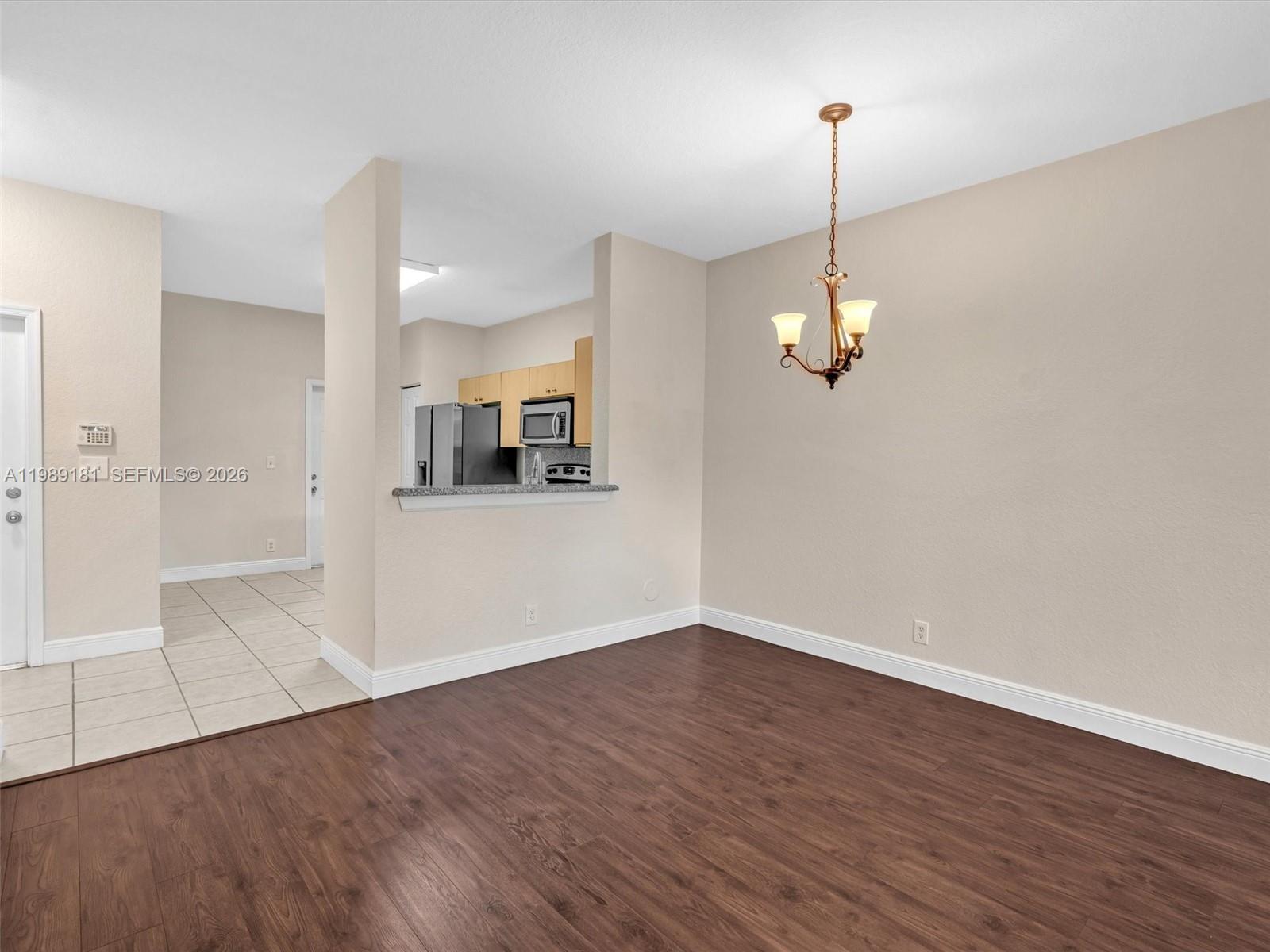 4126 Forest Drive Weston, FL 33332 - Photo 10 of 37 a view of a kitchen with a dishwasher cabinets and wooden floor