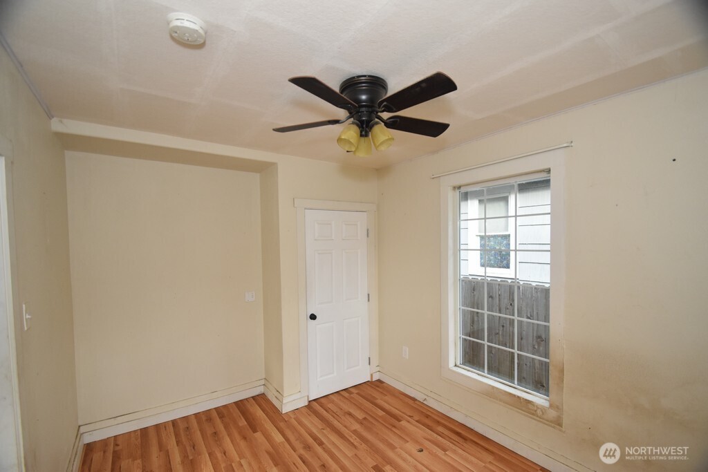 7490 Mill Avenue Concrete, WA 98237 - Photo 14 of 35 a view of a livingroom with a window and a ceiling fan