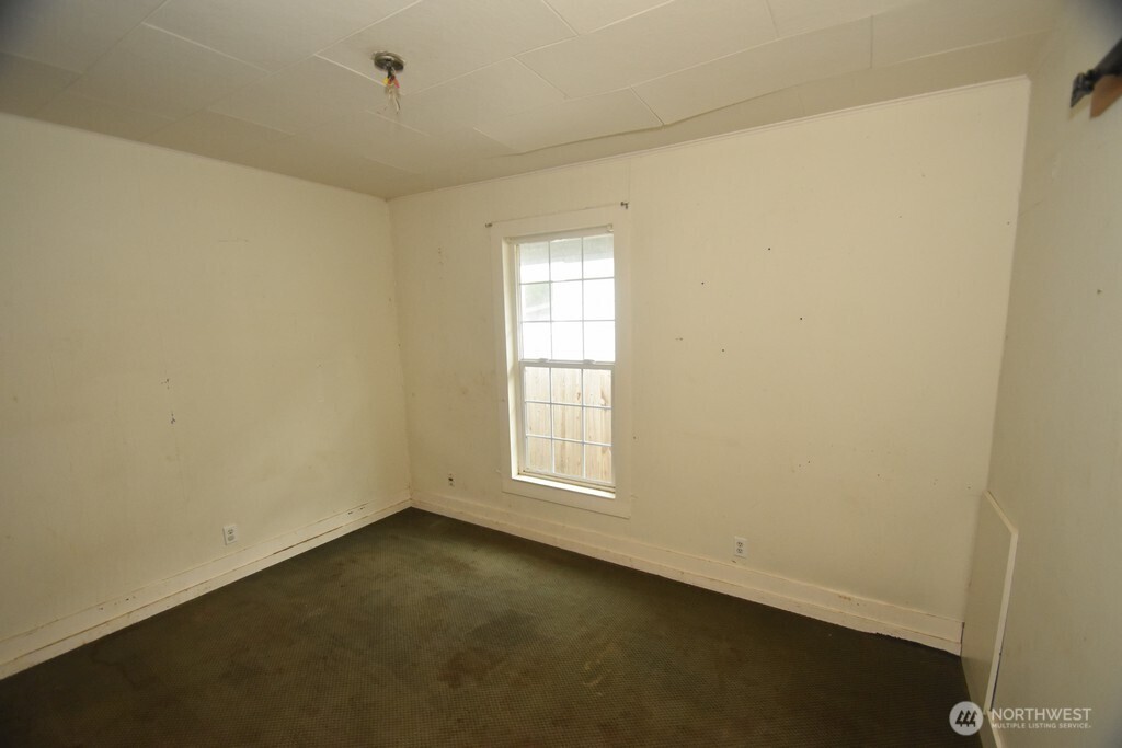 7490 Mill Avenue Concrete, WA 98237 - Photo 15 of 35 an empty room with a window
