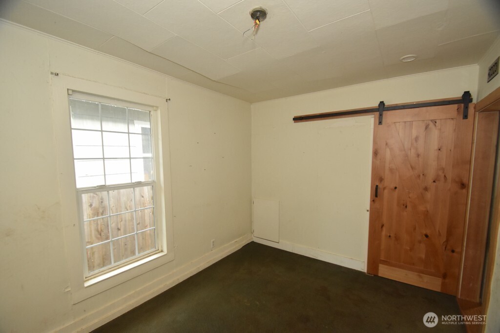 7490 Mill Avenue Concrete, WA 98237 - Photo 16 of 35 a view of an empty room with a window