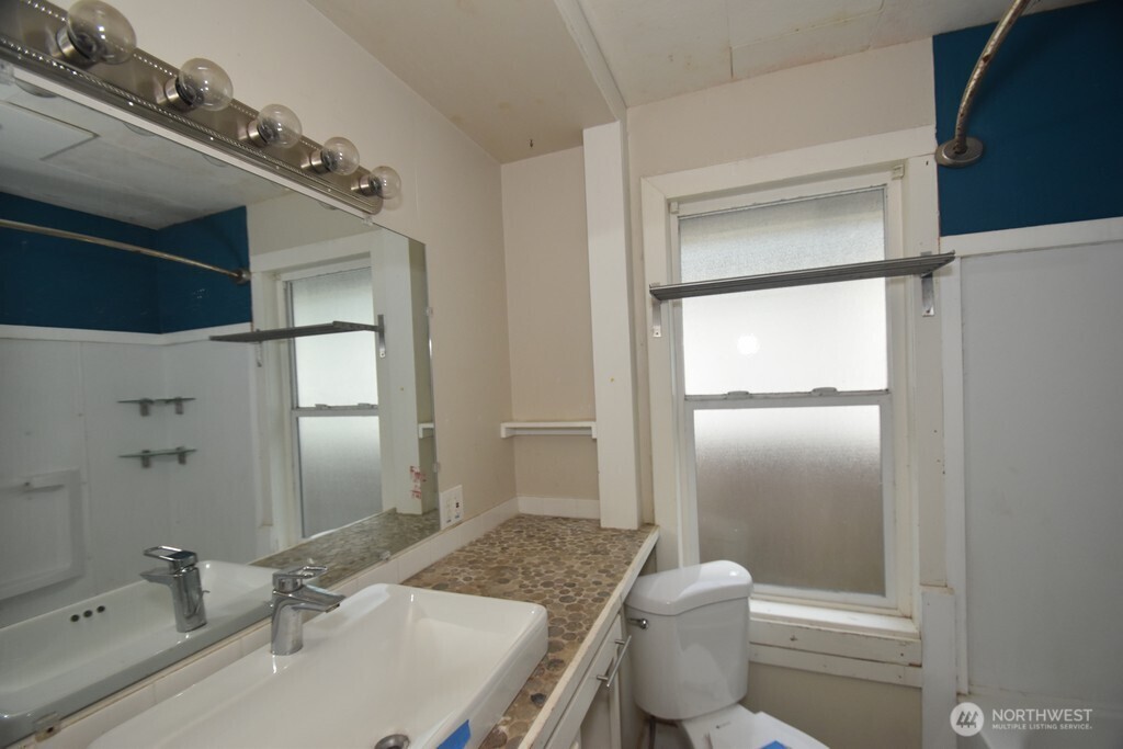 7490 Mill Avenue Concrete, WA 98237 - Photo 17 of 35 a bathroom with a granite countertop sink toilet and shower