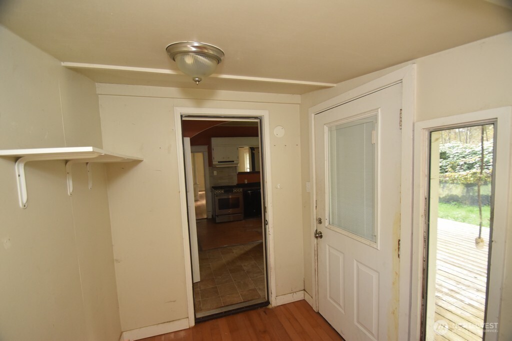 7490 Mill Avenue Concrete, WA 98237 - Photo 20 of 35 a view of a hallway with wooden floor