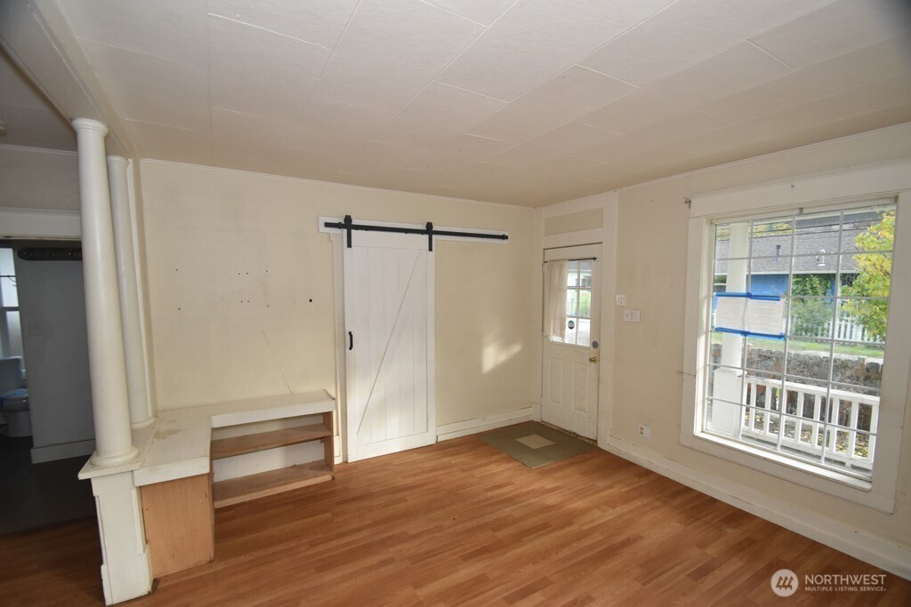7490 Mill Avenue Concrete, WA 98237 - Photo 4 of 35 wooden floor in an empty room with a window