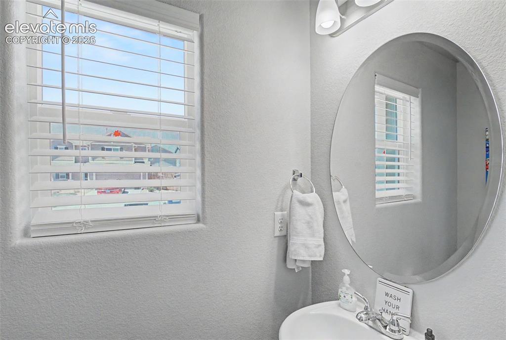 10957 Avena Road Peyton, CO 80831 - Photo 16 of 34 Powder room on main level with window