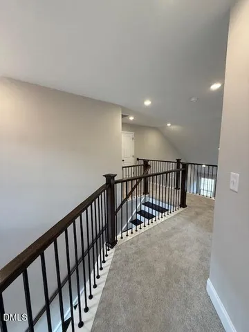 a view of hallway with stairs