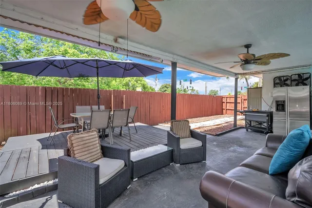 a outdoor space with patio the couches and a umbrella