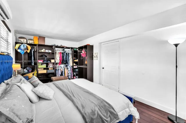 a bedroom with a bed and a closet