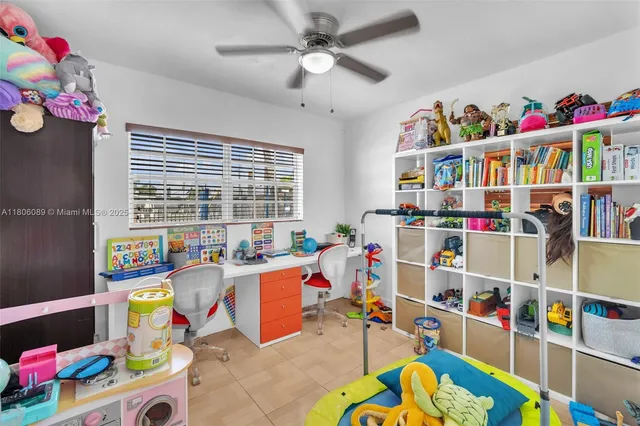 a living room filled with furniture and a book shelf