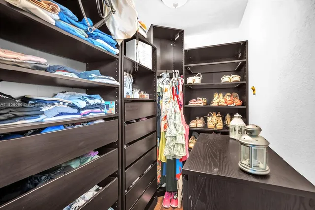 a living room with furniture a ceiling fan and a rug