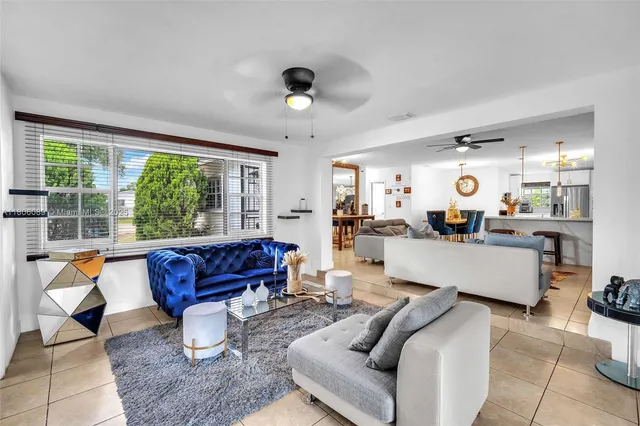 a view of an entryway with a flower pot and a bookshelf
