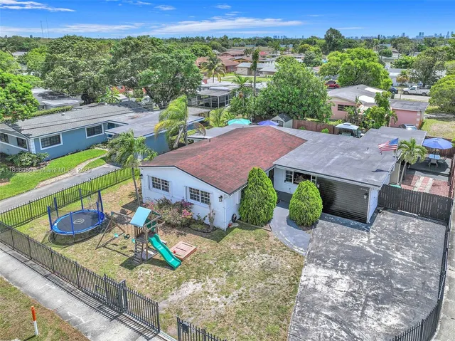 a patio with a patio table and chairs