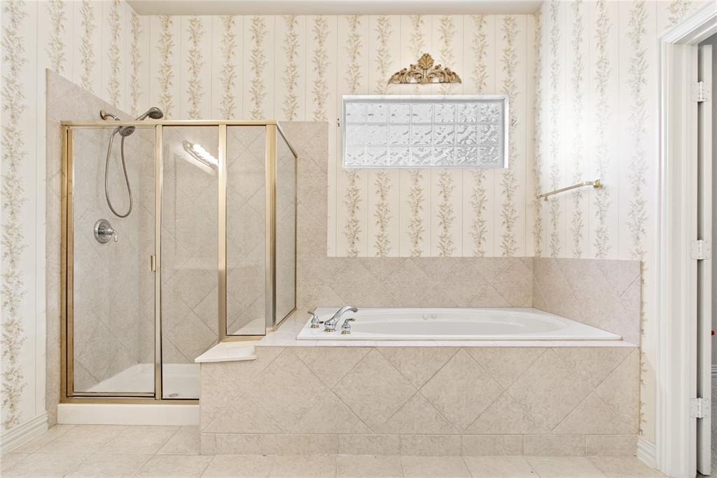 1614 Villa Court Corinth, TX 76210 - Photo 14 of 17 Full bath featuring a garden tub, wallpapered walls, a shower stall, and tile patterned floors