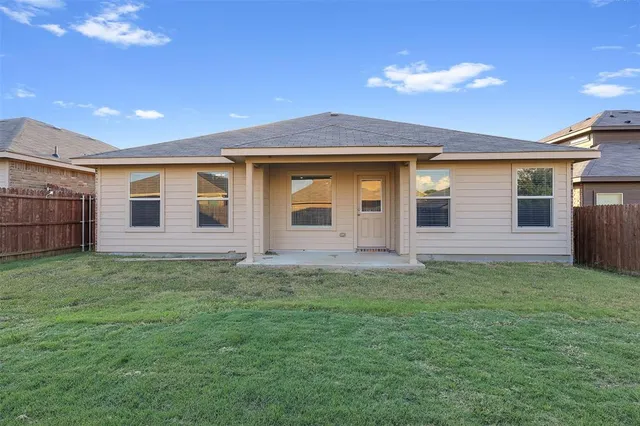 a backyard of a house with large trees