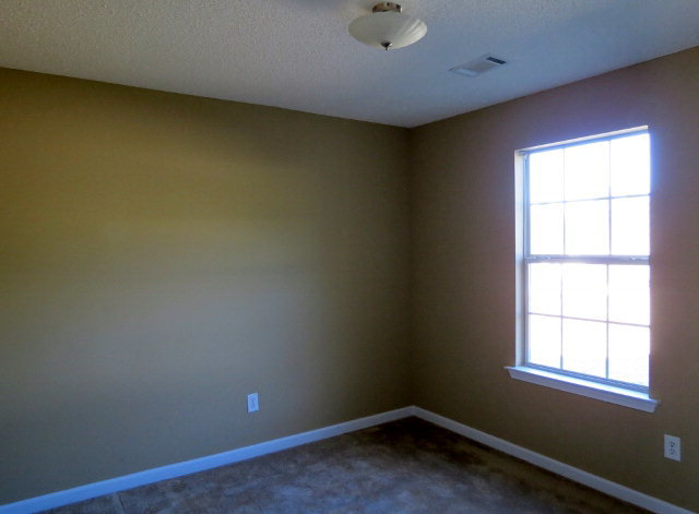 3390 Trotters Ridge Trail Gray, GA 31032 - Photo 11 of 13 an empty room with a window
