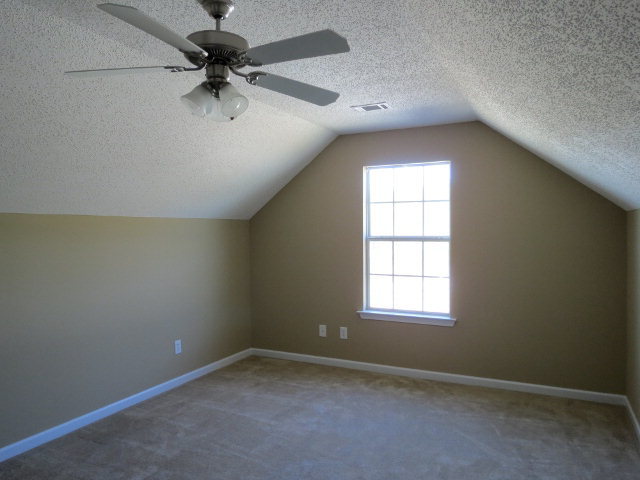 3390 Trotters Ridge Trail Gray, GA 31032 - Photo 13 of 13 an empty room with a window and a fan