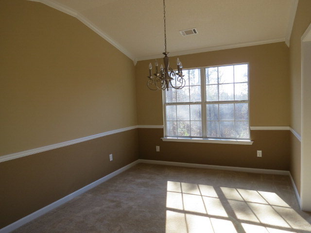3390 Trotters Ridge Trail Gray, GA 31032 - Photo 4 of 13 an empty room with a empty space and windows