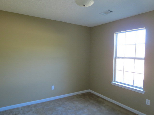 3390 Trotters Ridge Trail Gray, GA 31032 - Photo 8 of 13 an empty room with a window