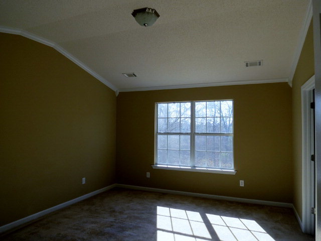 3390 Trotters Ridge Trail Gray, GA 31032 - Photo 9 of 13 a view of an empty room with a window