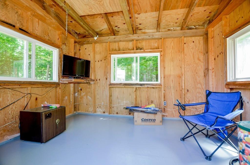 899 Walnut Plain Road Rochester, MA 02770 - Photo 12 of 42 a living room with furniture and a flat screen tv