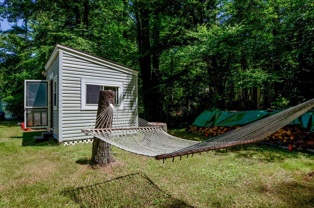 899 Walnut Plain Road Rochester, MA 02770 - Photo 13 of 42 a view of a house with backyard