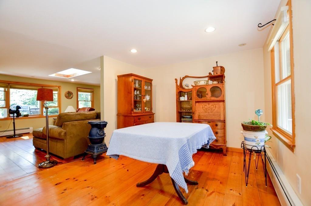 899 Walnut Plain Road Rochester, MA 02770 - Photo 17 of 42 a living room with furniture and a large window