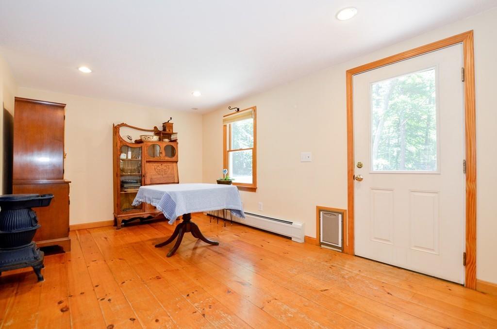 899 Walnut Plain Road Rochester, MA 02770 - Photo 18 of 42 a view of a workspace with furniture and a window